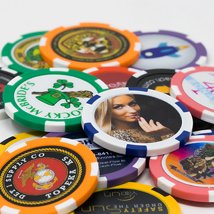 Poker chips in different colors and designs spread out