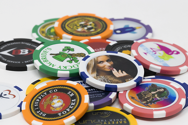 Poker chips in different colors and designs spread out